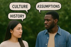 A young couple engaged in meaningful discussion, with speech bubbles showing words like “culture” and “history” — symbolizing the communication vital to healthy interracial intercourse.