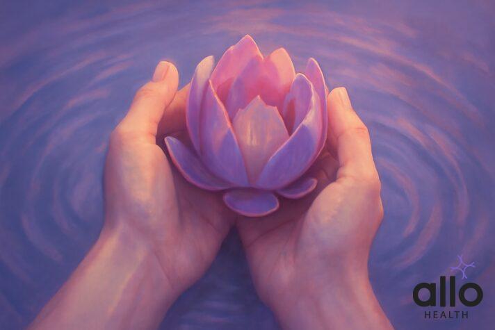Gentle hands holding a blooming flower over water, symbolizing the intimate journey of self-exploration and discovering what feels good for your body through different masturbation techniques.