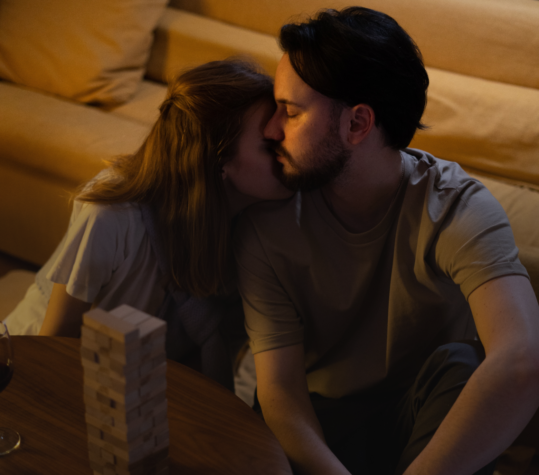 Couple sitting close together on a sofa