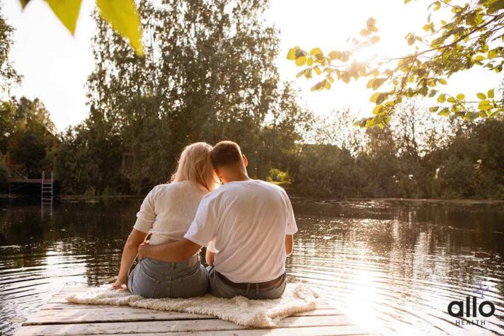 couple sitting and holding each other - Sensate Focus
