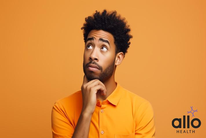 Confused man thinking about ling par naso ka dikhna is normal or problem.