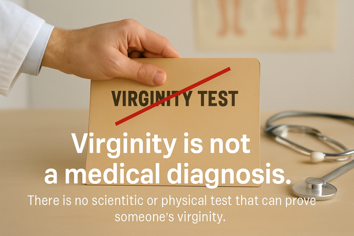 **Alt text (short version):** Doctor’s hand closing a folder labeled “Virginity Test” crossed out in red, with medical items on the desk.
