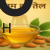 आयुर्वेदिक इन्फोग्राफिक: badam ka tel ling par lagane ke fayde, काँच के बर्तन में सुनहरा बादाम तेल, चारों ओर बादाम और हरी पत्तियाँ, पुरुष की परछाईं के साथ