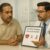 “Indian man discussing post-surgery erectile function recovery with a doctor in a hospital consultation room, with soft medical icons in the background.”