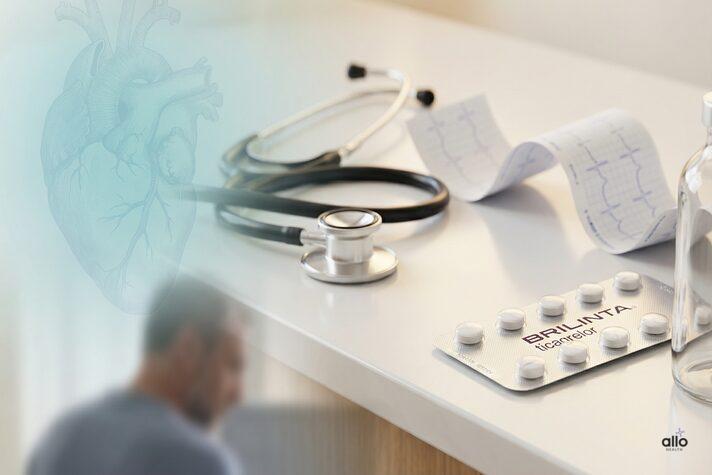 Brilinta (ticagrelor) and Erectile Dysfunction: How Blood Thinners Affect Male Sexual Health 5 “Medical desk setup showing Brilinta tablets, ECG printouts, and a stethoscope, illustrating brilinta side effects erectile dysfunction and heart-related sexual health concerns.”