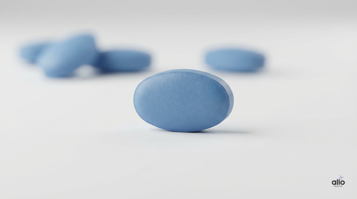 Tadalafil tablet in focus showing tadalafil dose for erectile dysfunction, with other tablets softly blurred in the background.